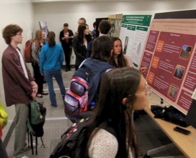 BERI Symposium - Presenters and attendees gathered in Steger 118 to view posters about ecological restoration research.