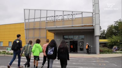 Elementary students enter the Melrose Branch of the Roanoke Public Libraries to attend Flip the Fair.