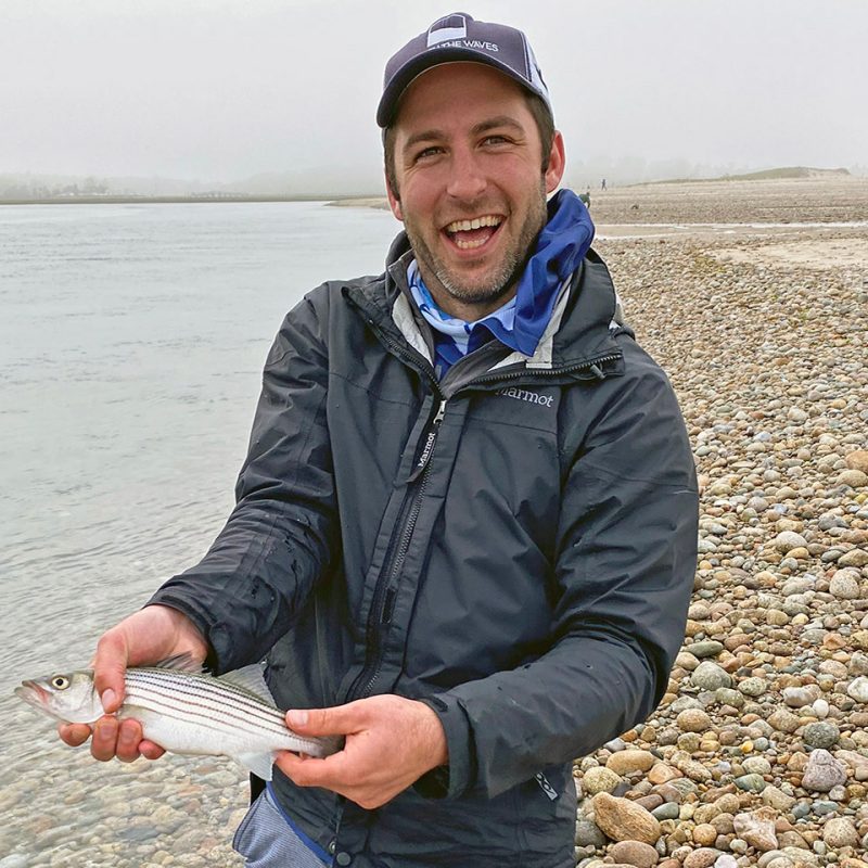 Photo of Brendan Shea holding a fish