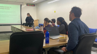 In-person attendees listen to presentation